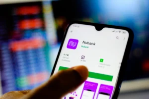 nubank-roxo34-compra-banco-porto-real-licenca-bancaria